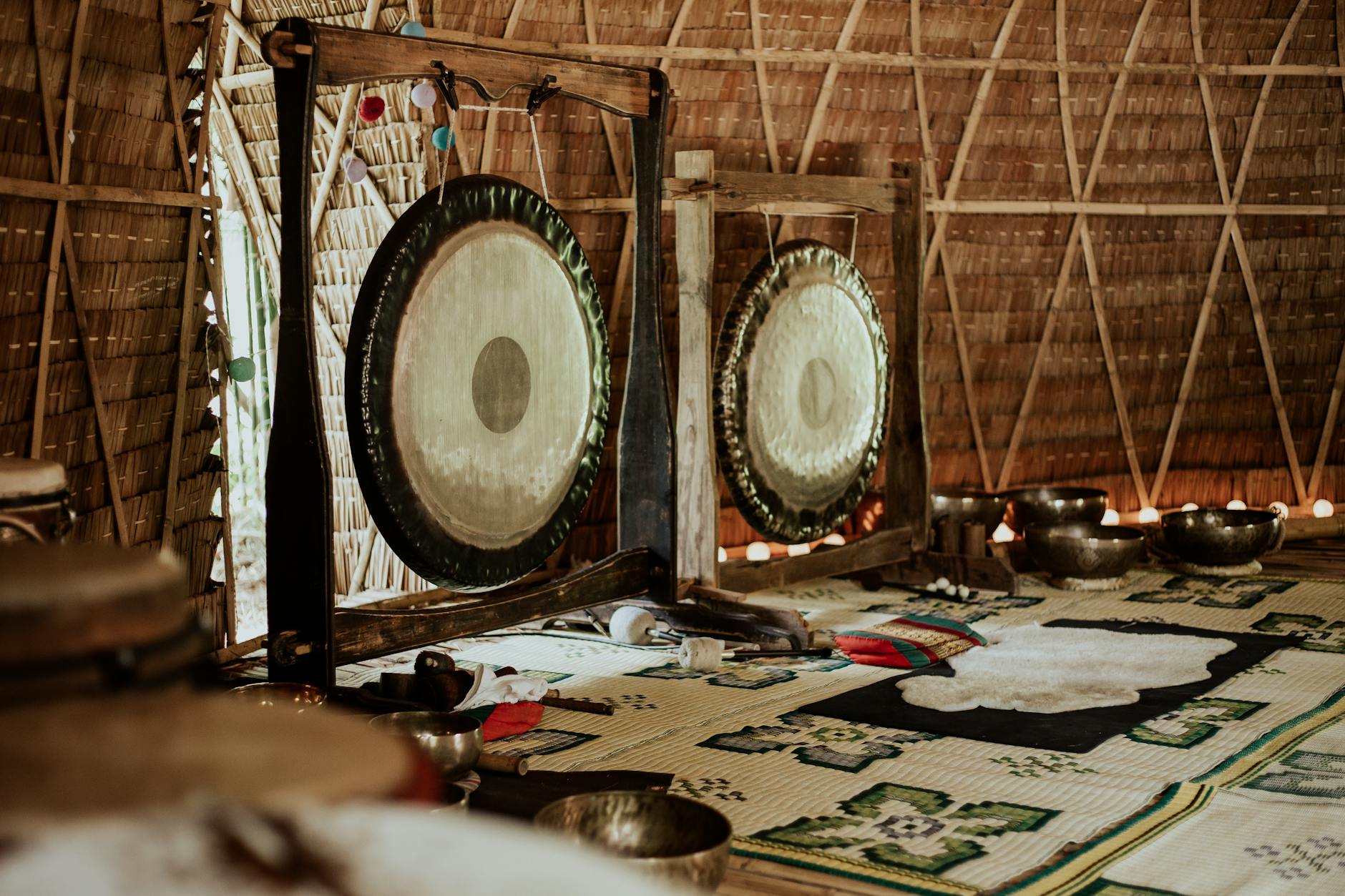 a room with gongs and tibetan bowls for meditation